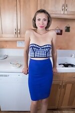 Amber Faye strips naked while in her kitchen