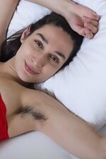 Janetta awakens nude in her sleeping bed