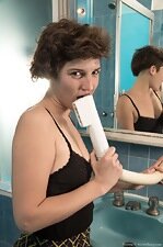 The petite Tatiana strips naked in her bathroom 